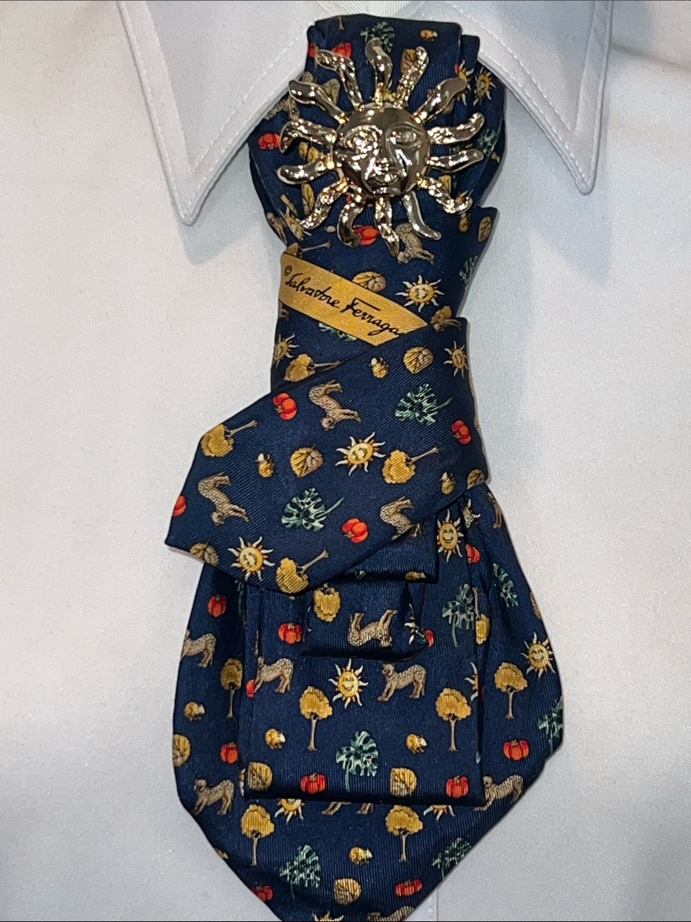 Salvatore Ferragamo Navy Silk Tie Necklace Gold Sun Brooch and Multicolor Motif